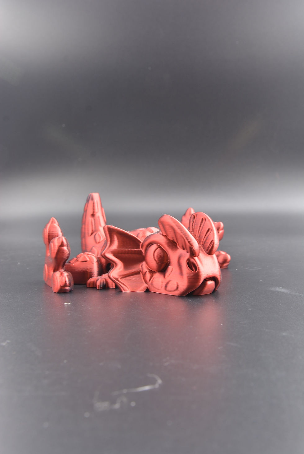 Dilophosaurus flexi dinosaur figure in random color with articulated wiggly movement