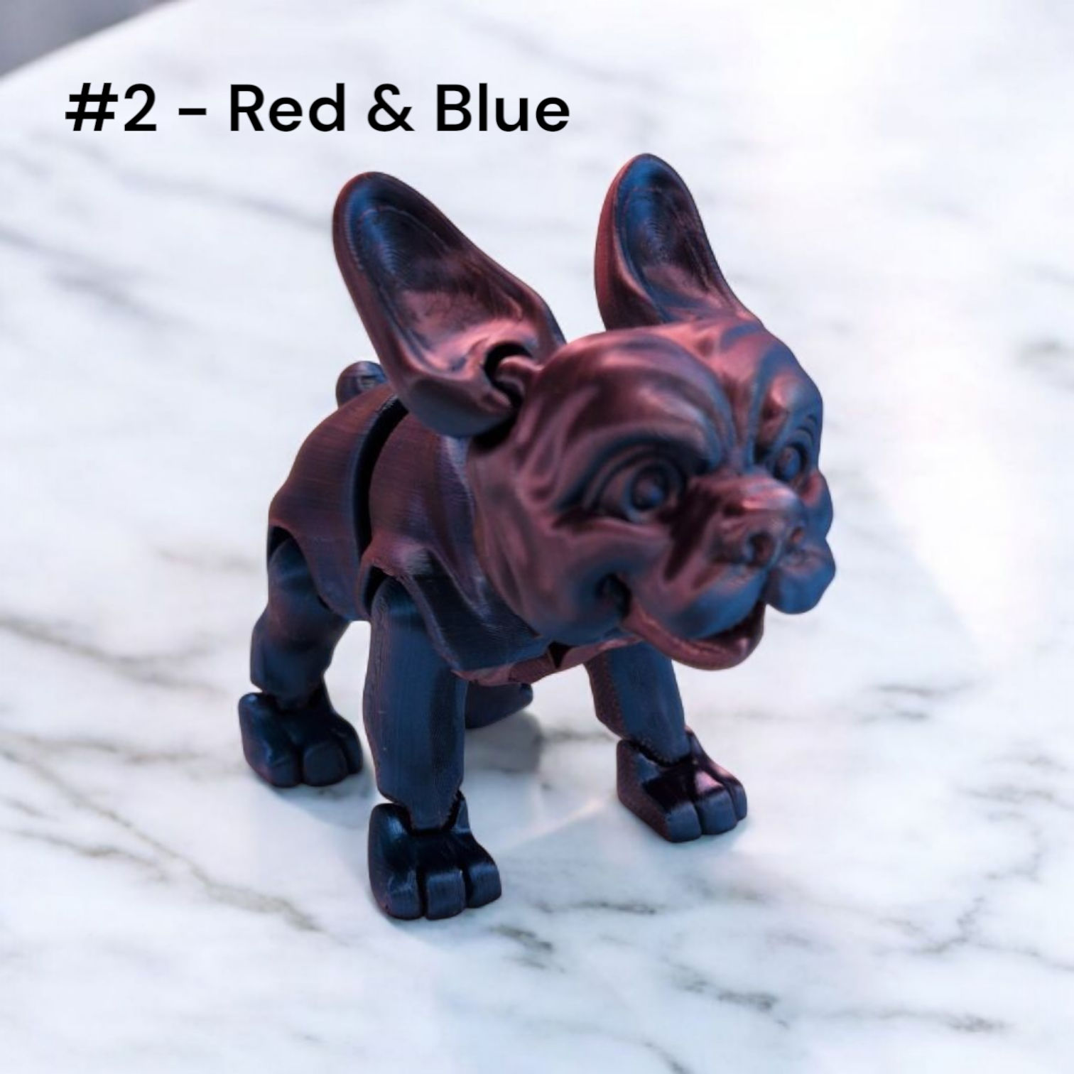 3D-printed Stella the French Bulldog figure with articulated limbs and signature wrinkled detailing. Inspired by the TV chara