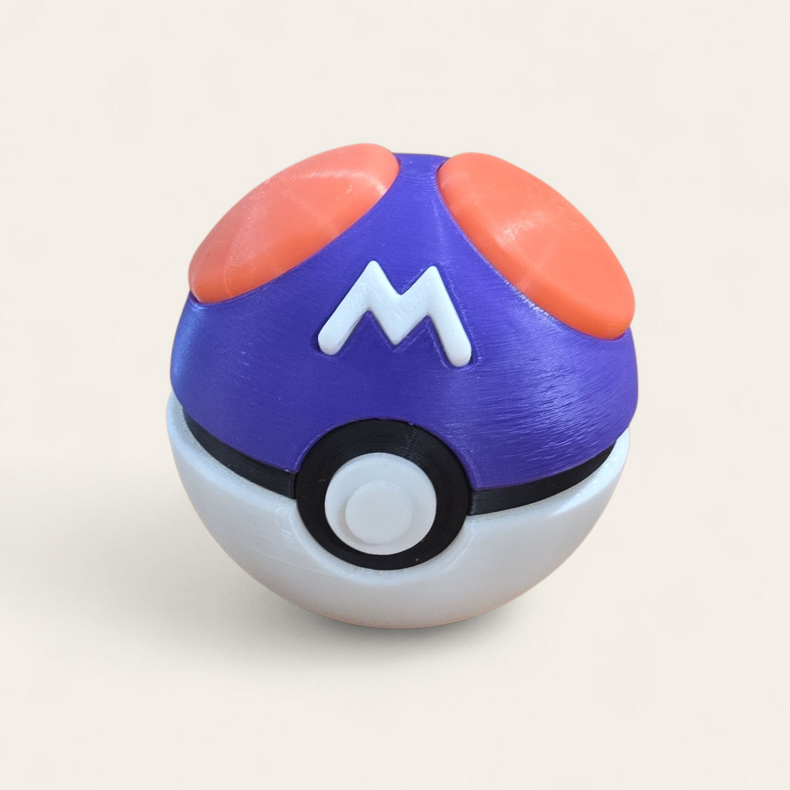 Purple Poké Ball with bold “M” and pink accents, inspired by the Master Ball