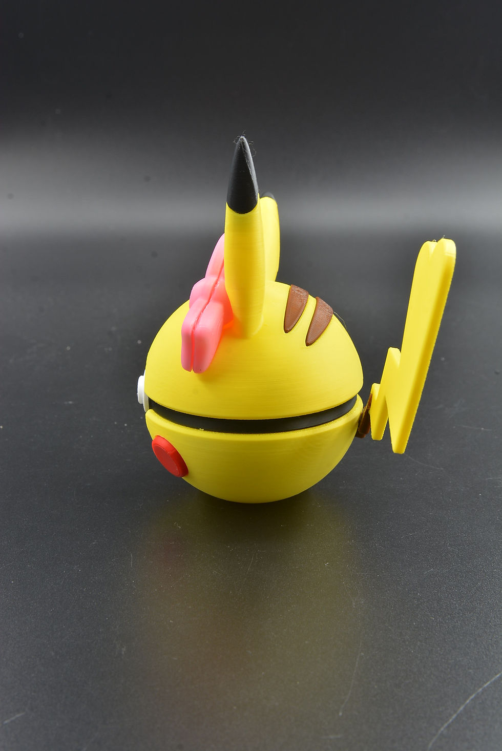 Thumbnail: Yellow Poké Ball with heart-shaped tail motif, inspired by Female Pikachu