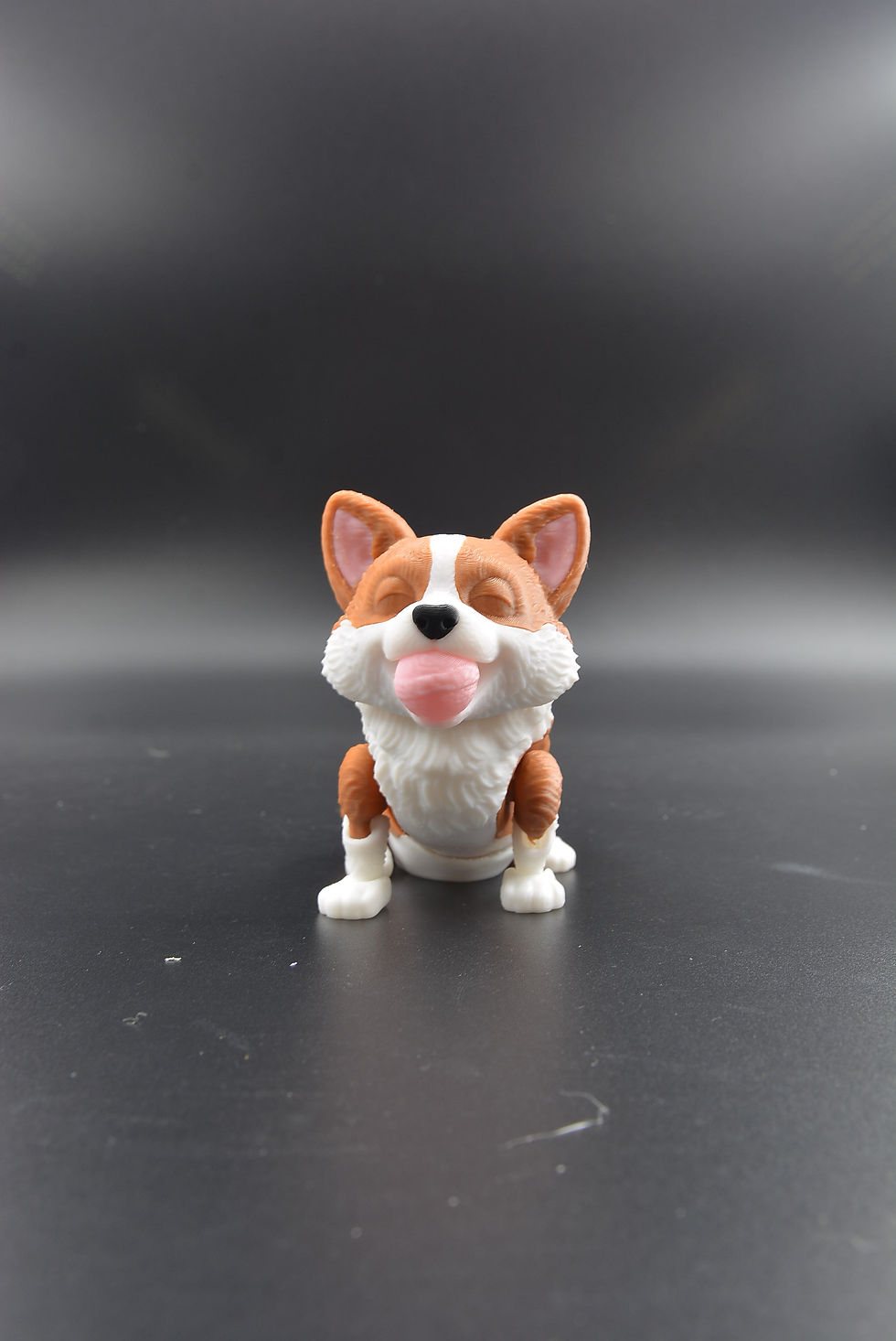 3D printed corgi flexi holding a small ball