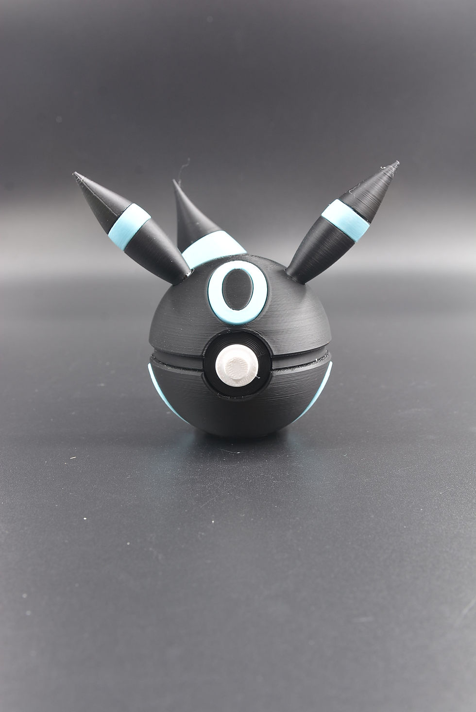 Thumbnail: Umbreon-inspired ball with black finish and glowing yellow ring accents