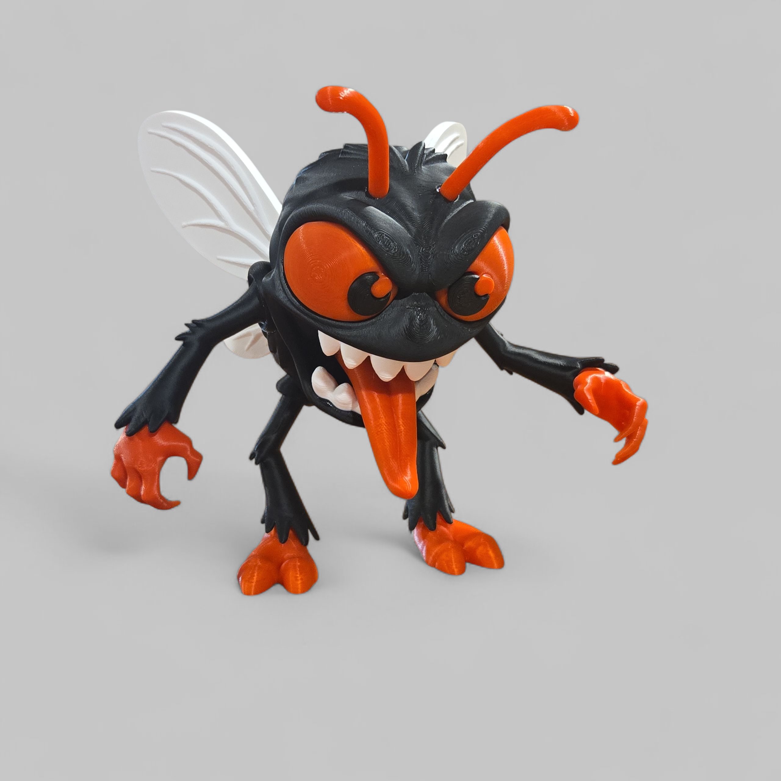 3D printed fly monster figure named The Fly Guy with bulging eyes and tongue. Not a toy.
