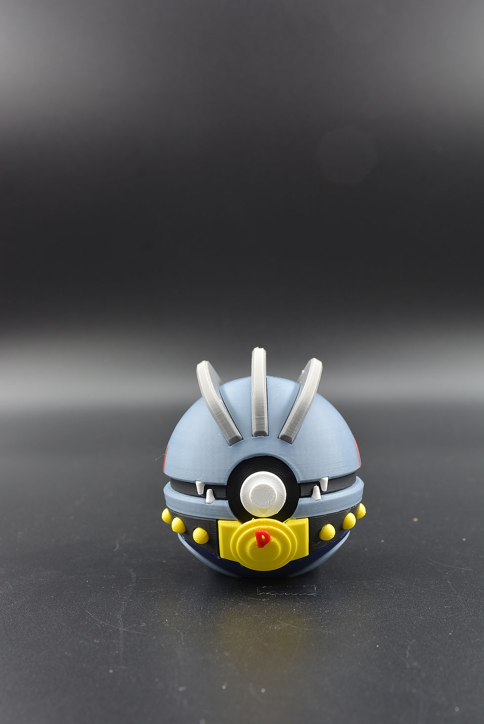Full‑color Machoke Character Ball with detailed fighting‑type sculpt.