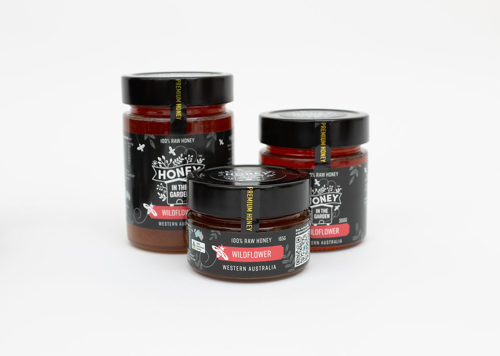 Eye-level view of assorted jars of honey in a farmer's market