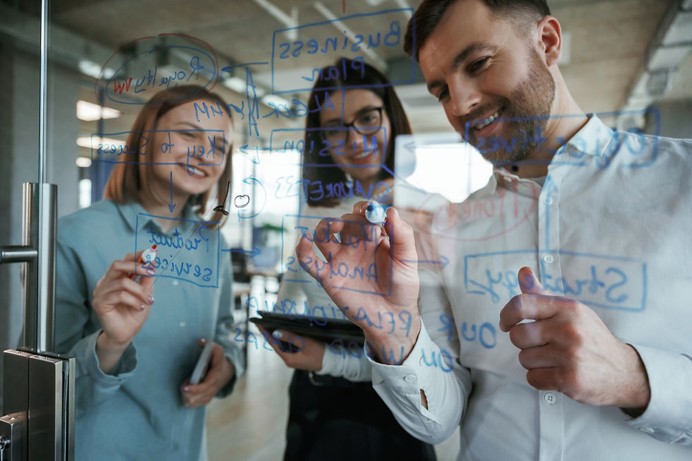 front-view-office-workers-are-creating-plan-standing-by-glass-writing-it.jpg