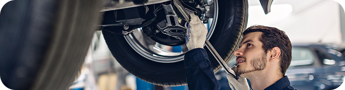 auto-car-repair-service-center-mechanic-examining-car-suspension (3) 1.png