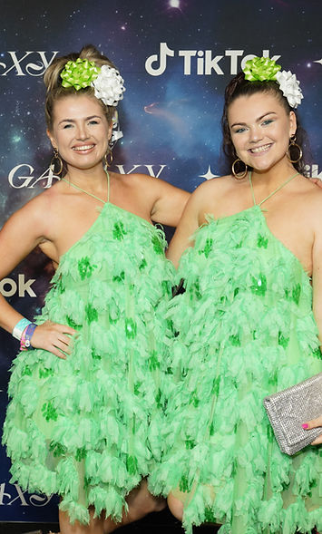 The Sugarcoated Sisters (Chloe Tingey and Tabby Tingey) attend TikTok’s exclusive party at VidCon Los Angeles in matching green dresses. The award-winning musical comedy duo have over 2.7 million followers for their viral comedy songs and videos.