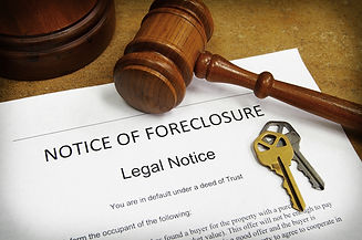 Foreclosure document with house keys and