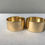 Thumbnail: Gold Napkin Rings engraved with “Mr” and “Mrs”
