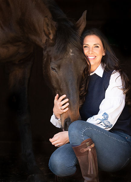 owner crouching down cuddling her horses head taken by Belinda Dix Photography