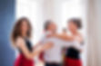 Group of senior people in dancing class with dance teacher..jpg