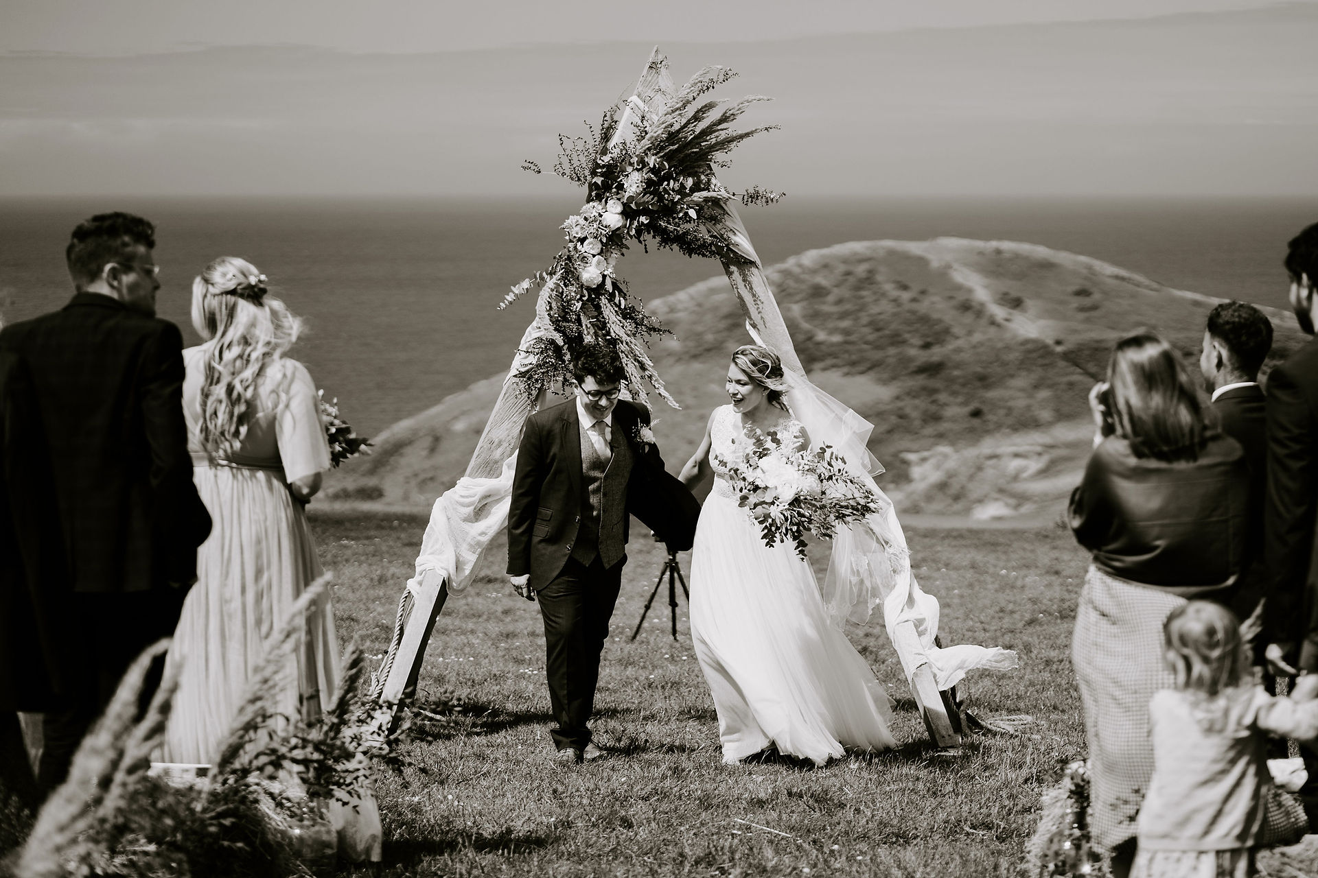 Bride and groom walking back down the aisle.