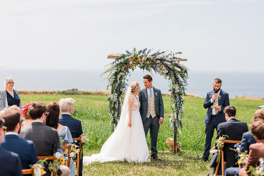 Charlie and Adam's Festival Wedding Overlooking The Sea 