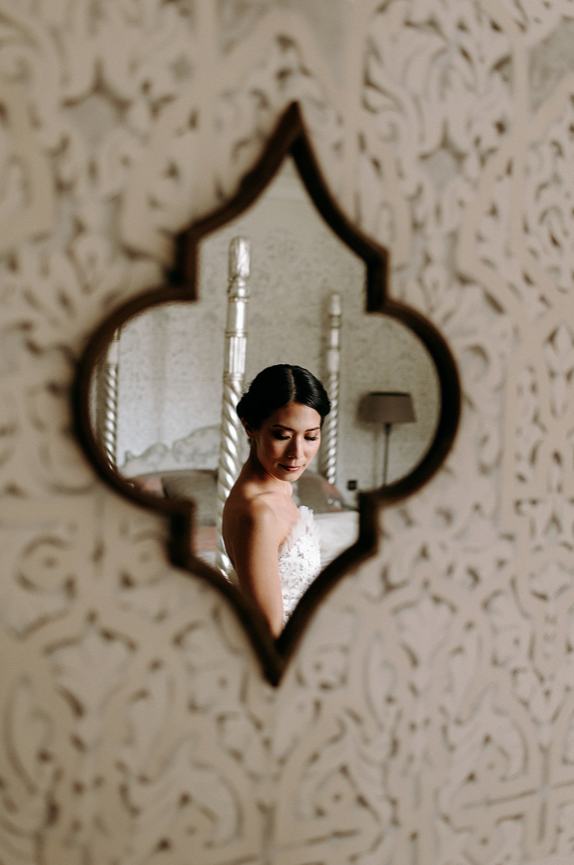 Reflection in a mirror of a bride.