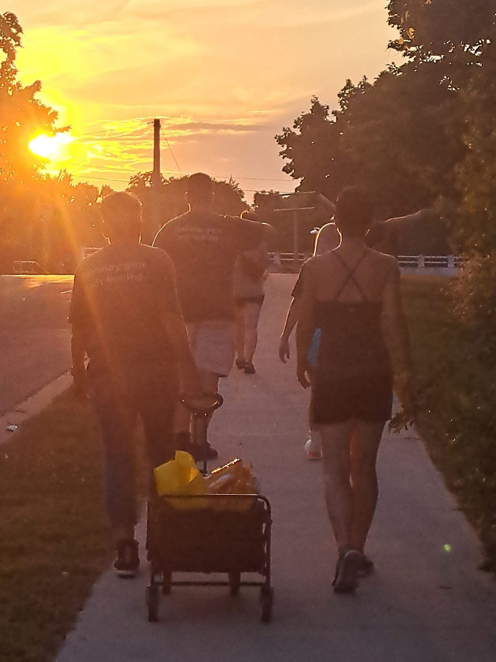 Beyond The Streets volunteers walking on the streets of Welland at sunset