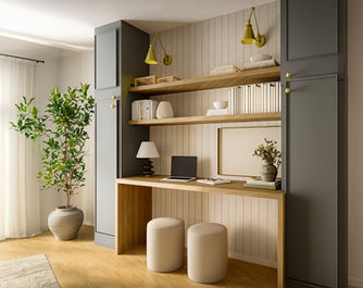 Cozy home office with desk, laptop, shelves, and decorative items. Camila Interiors