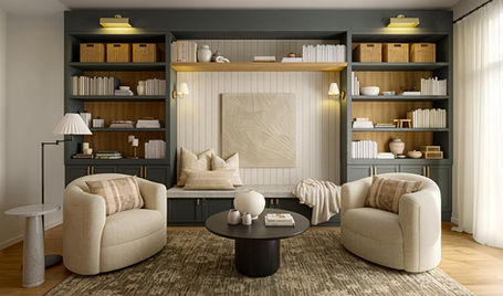 Cozy living room with built-in shelves, chairs, and coffee table Camila Interiors.