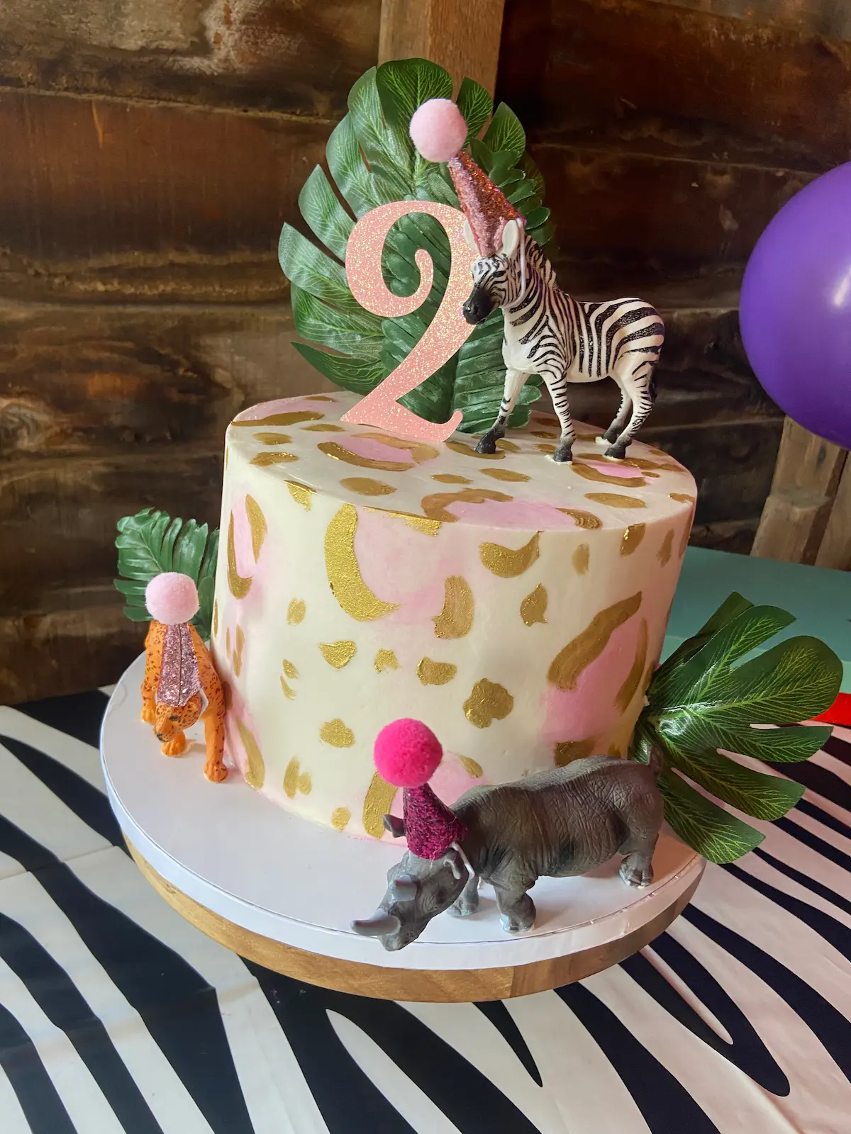 white pink and gold birthday cake with a 2 on top