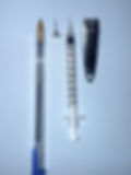 Size comparison for GLP-1 syringes - L to R, a standard ballpoint pen, a stud earring, a Zepbound vial needle, and a small nail clipper.