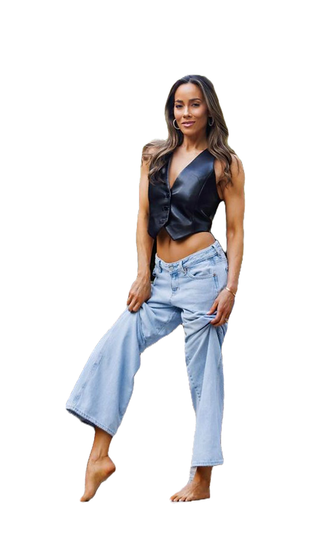 Ashley Legg standing in jeans and a black leather top