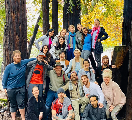 Community group gathered in nature during a shamanic retreat, sharing connection, healing, and spiritual growth.