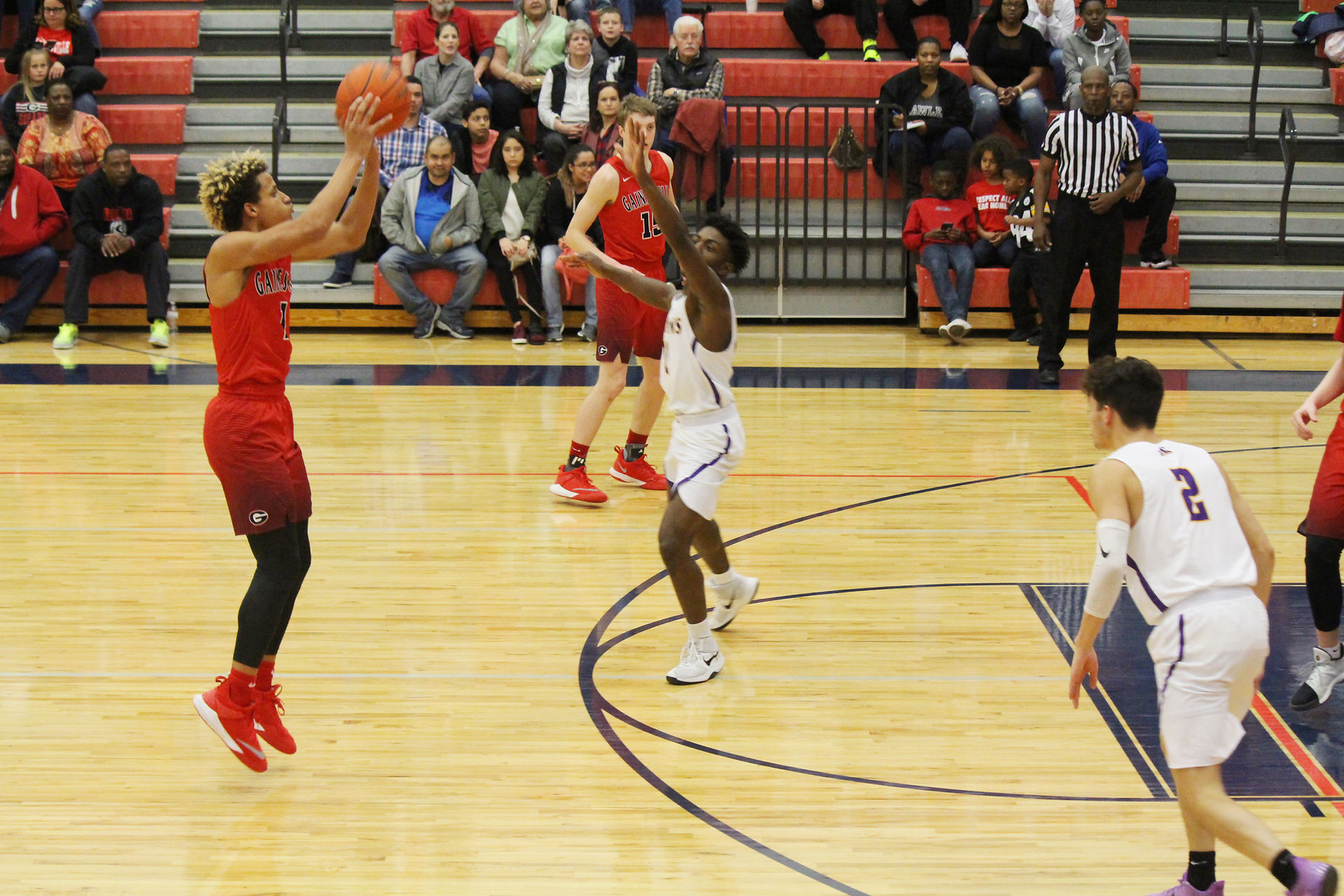 Josh Kemp shoots a three.