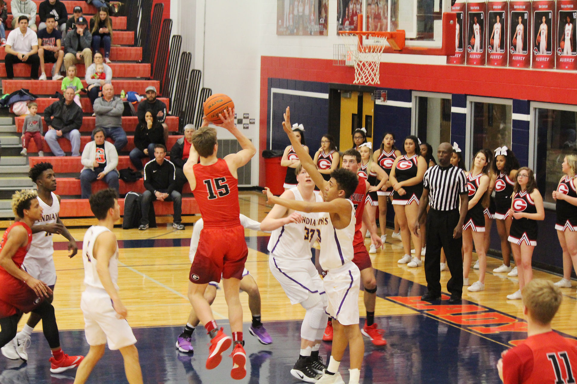 Trey Henderson and Tre Peoples try to block shot.