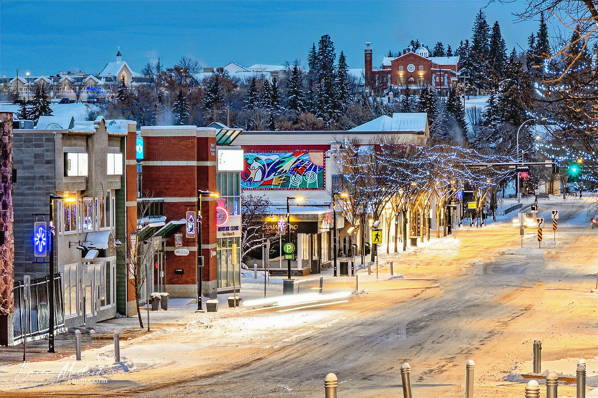 Snowy st albert street at dusk with illuminated buildings