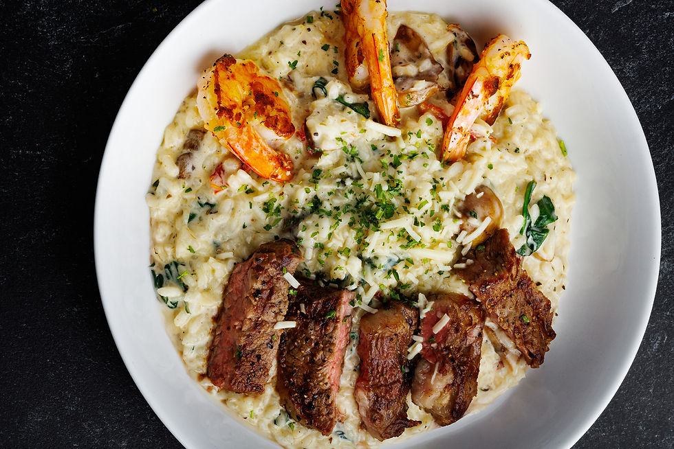 a plate of steak and shrimp risotto from Mo's Italian Bistro