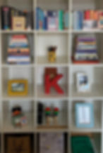 A close up of the After photo showing neatly stacked books and centrally arranged ornaments