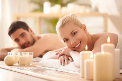 woman relaxing in spa with massage candles at Zen Spa