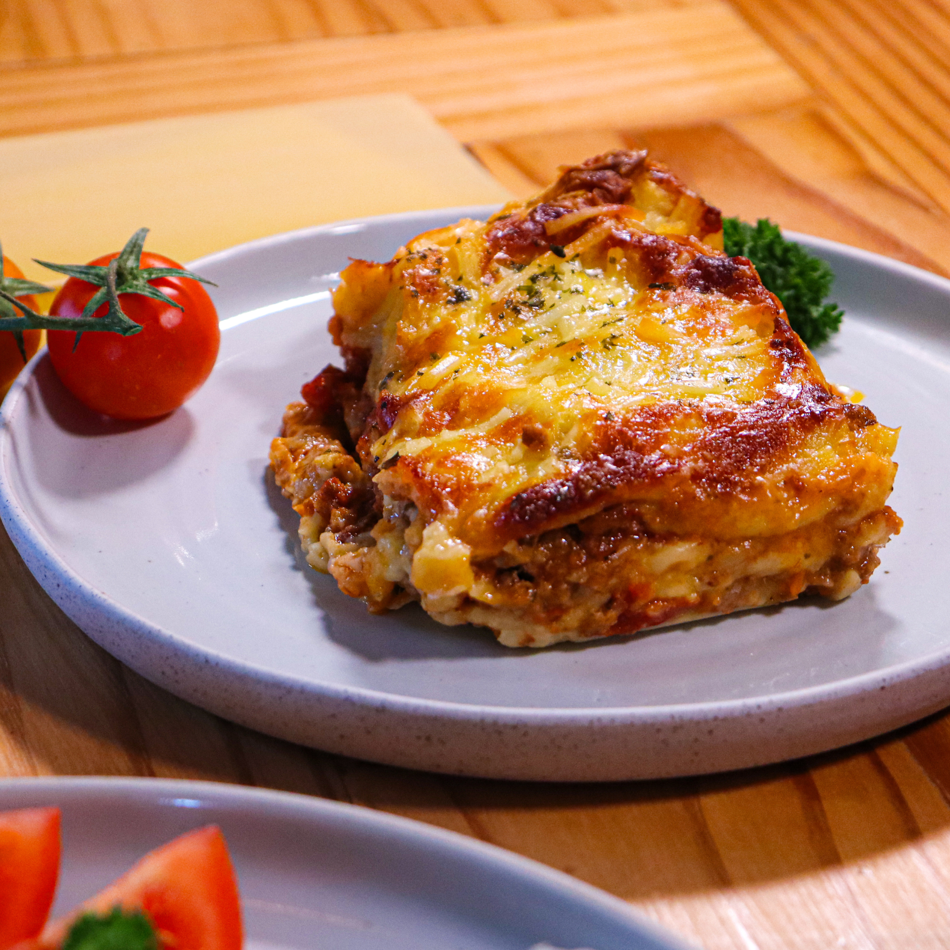 Close-up of classic beef lasagne with a golden cheese topping