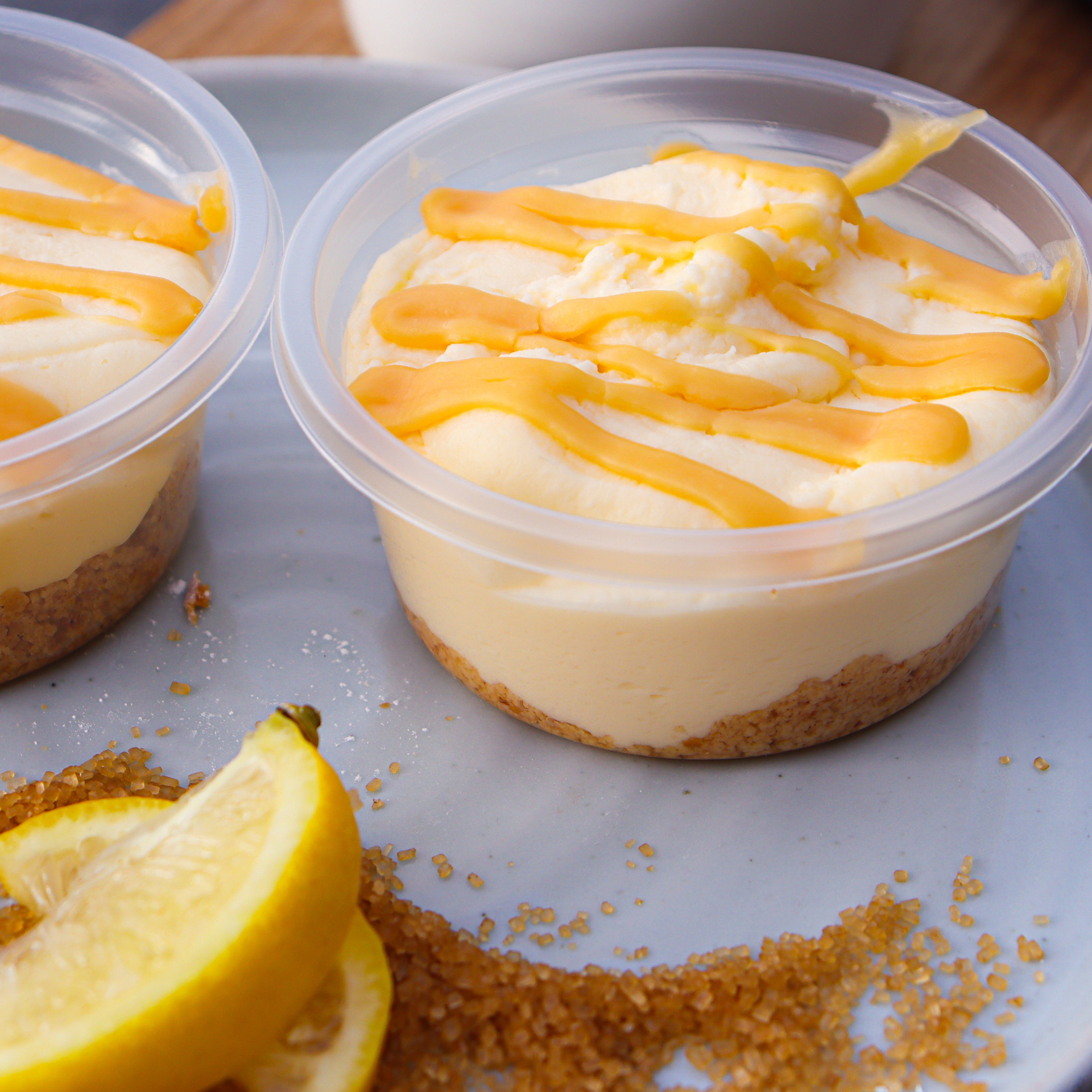 Close-up of a lemon and lime cheesecake in its pot with lemon