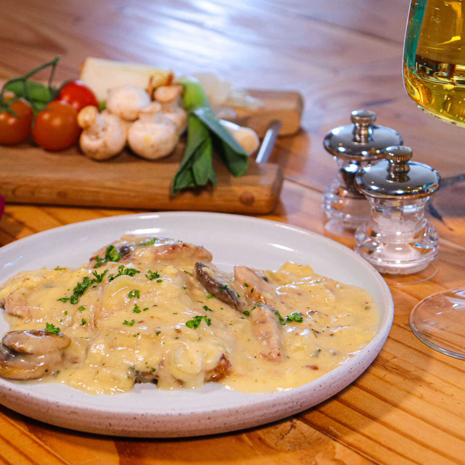 Close-up of pork medallions in a creamy brandy and mushroom sauce