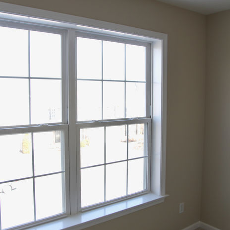 Window in cream colored room
