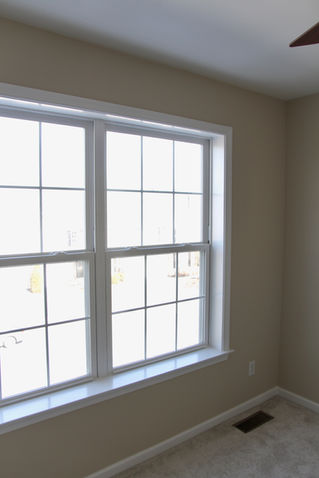 Window in cream colored room