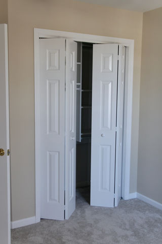 Two white bi-fold door
