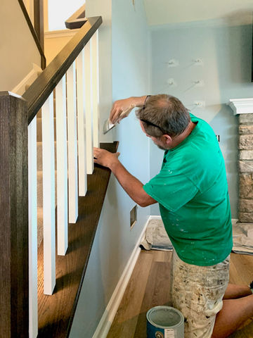 Man painting with brush