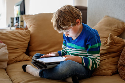 School boy with tablet computer. Schoolchild study online. Electronic device for learning,