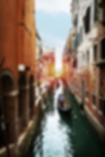 beautiful-view-venetian-water-channel-with-gondolier-boat-venice-italy.jpg