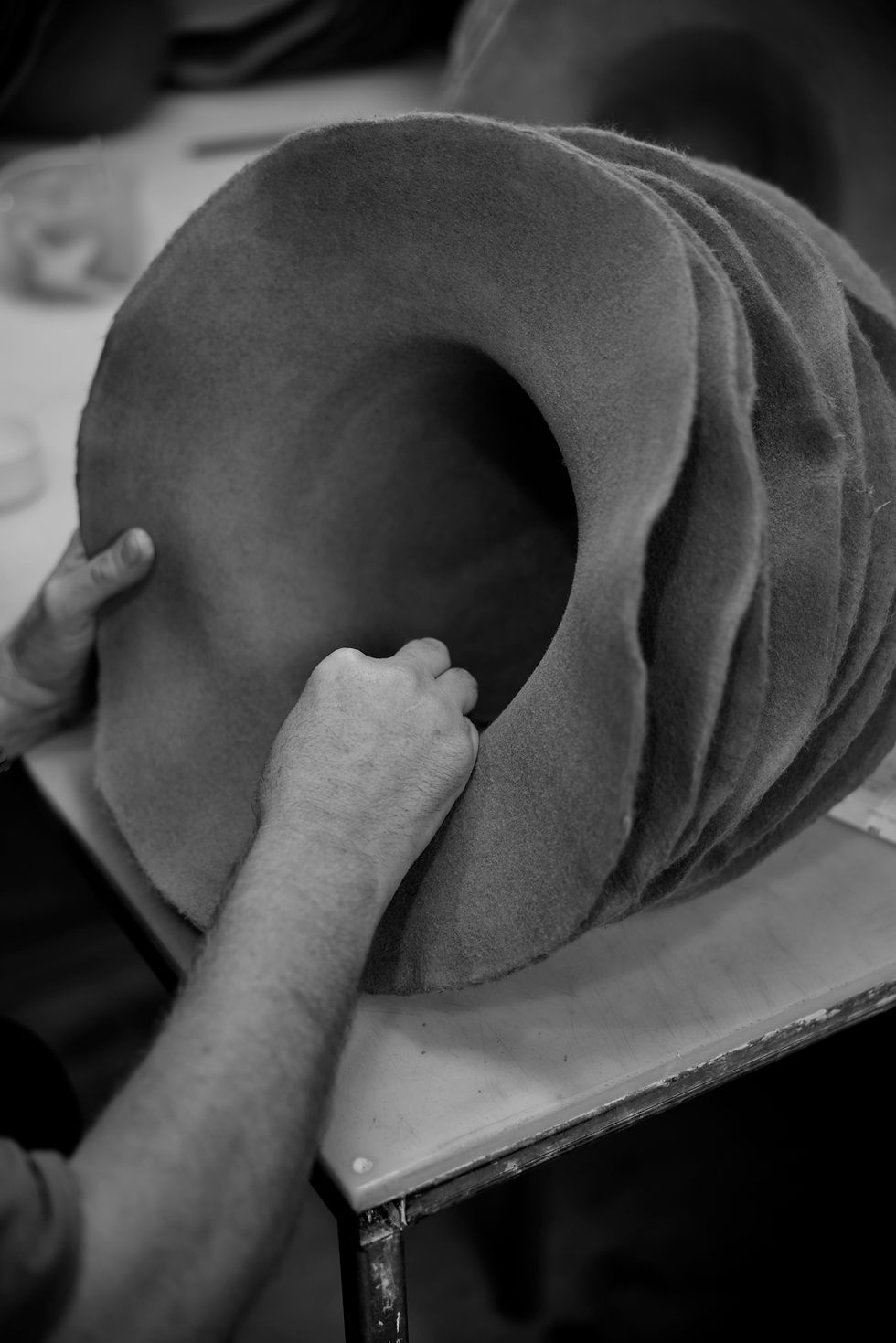 At this stage, each hood is carefully inspected by hand to ensure the felt meets Akubra's exacting quality standards before moving on to shaping and finishing