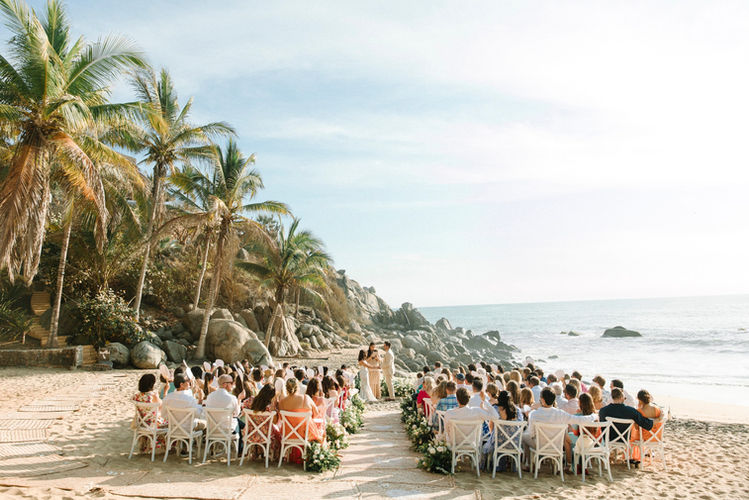 Beach wedding ceremony with guests,WEDDINGS