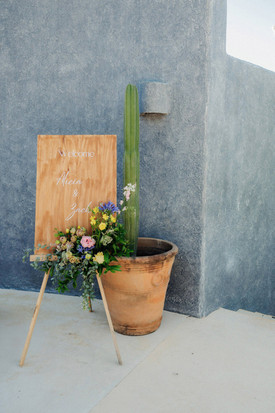 Wedding sign with floral arrangement