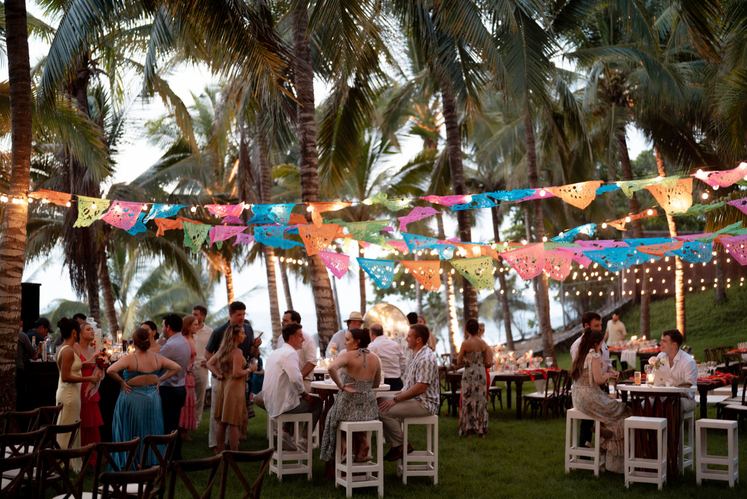 Guests enjoying a vibrant outdoor wedding reception