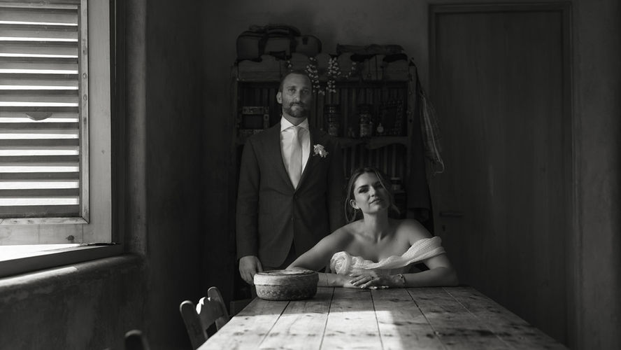 Black and white photo of a married couple and their baby