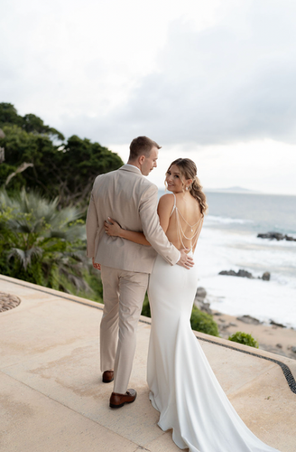 Happy couple walking oceanfront, WEDDINGS
