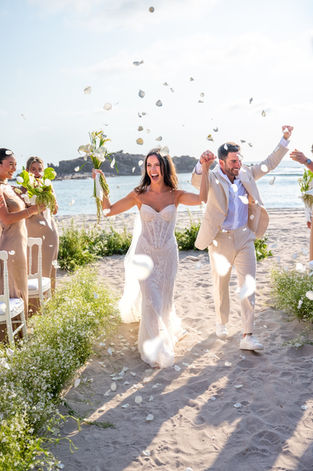 Happy couple's beach wedding ceremony