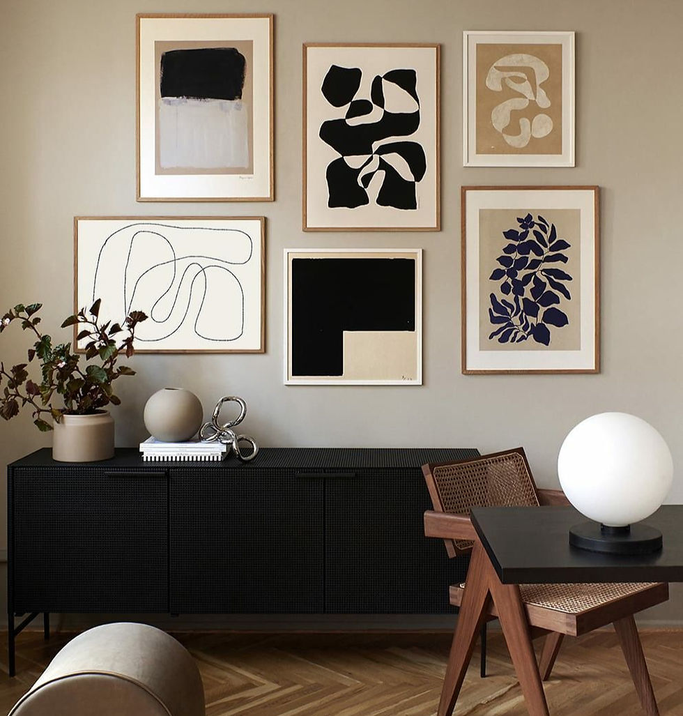 Abstract art prints displayed on wall to create a personal touch. 