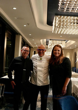 Chef with guests at an Explora Journeys restaurant